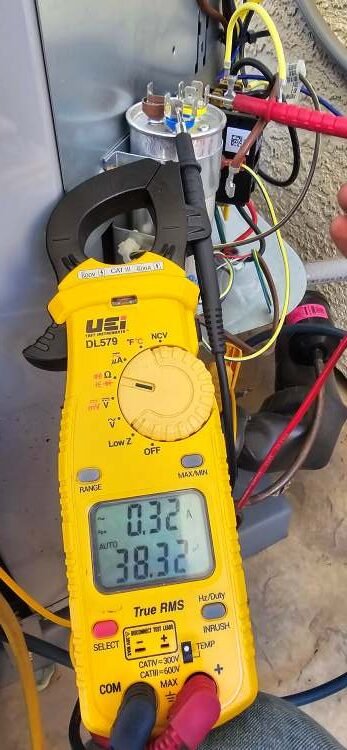 Levano Pro HVAC Solutions testing an HVAC capacitor on an outdoor AC unit in Sacramento