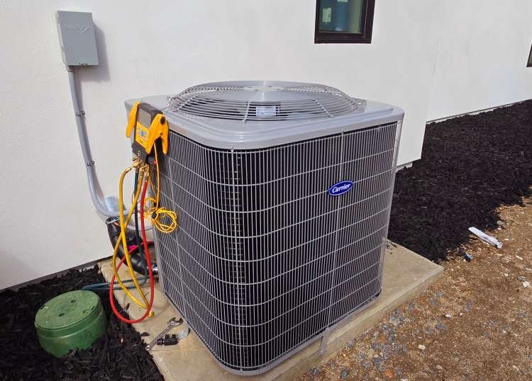 Carrier outdoor AC unit being tested with HVAC diagnostic gauges in Roseville