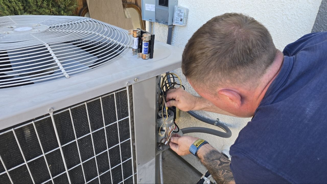 Levano Pro HVAC technician servicing a residential outdoor unit in the Sacramento area