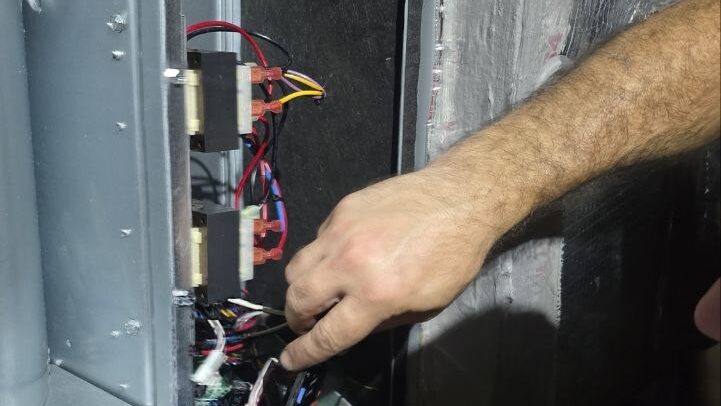Levano Pro HVAC technician tracing low voltage wiring at the relays inside an air handler